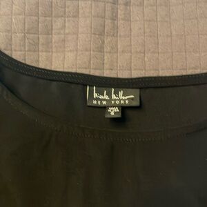 black Nicole Miller top with long sleeve flared, with cold shoulder.